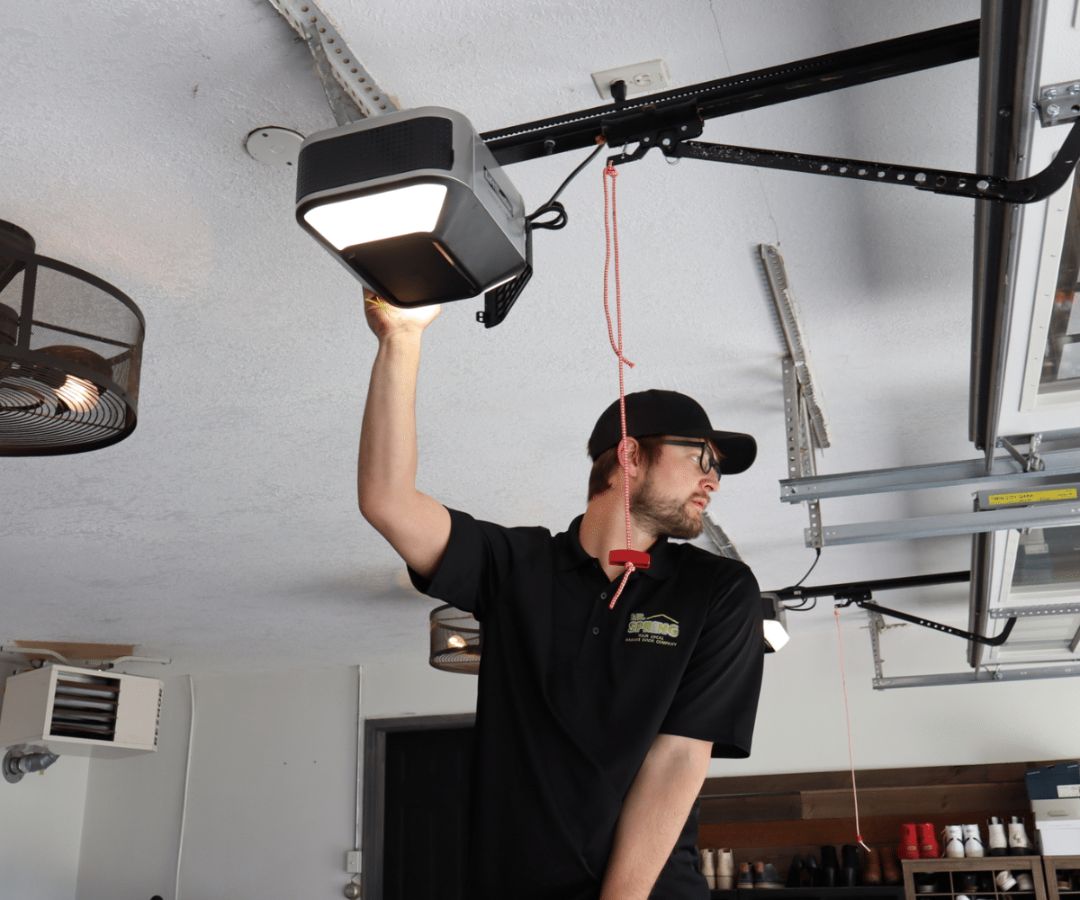Employee working on garage door opener