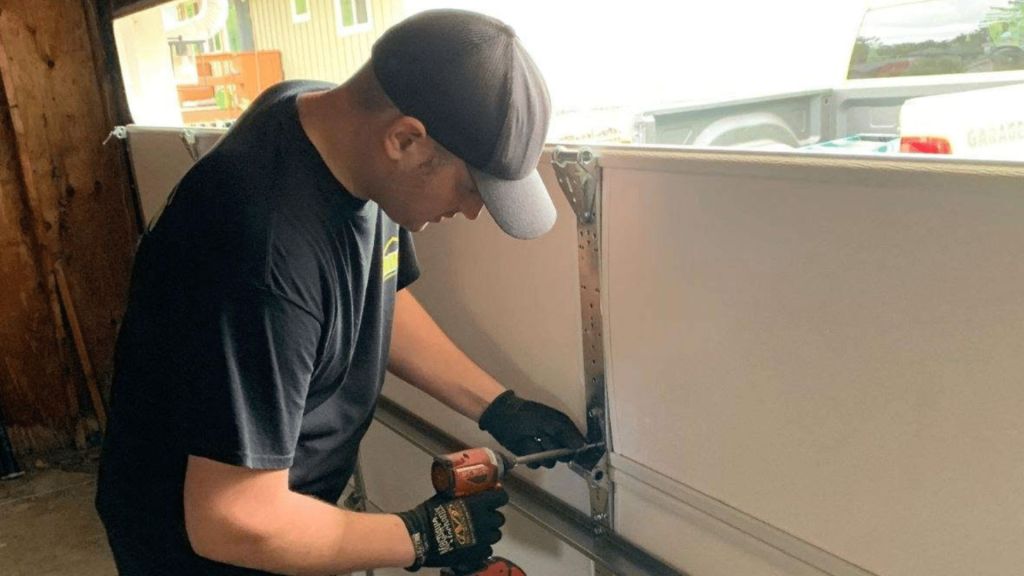 Mr. Spring employee working on a garage door