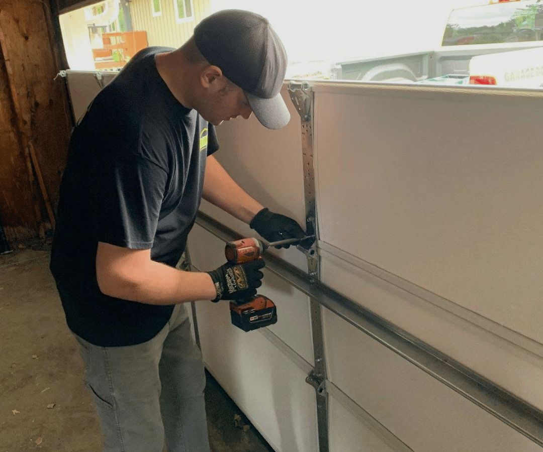 Employee doing garage door installation