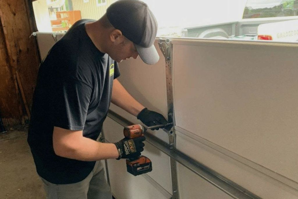 Technician working on garage door