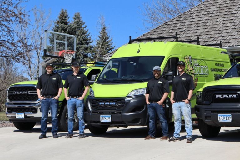 Mr. Spring employees standing in front of their trucks