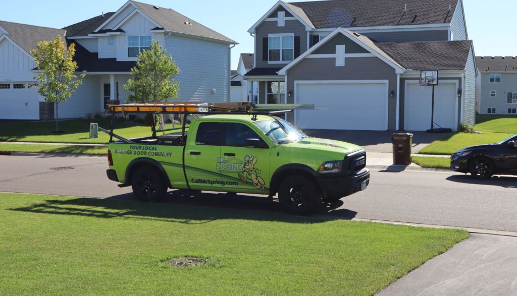 bright green Mr. Spring pickup parked on a suburban street