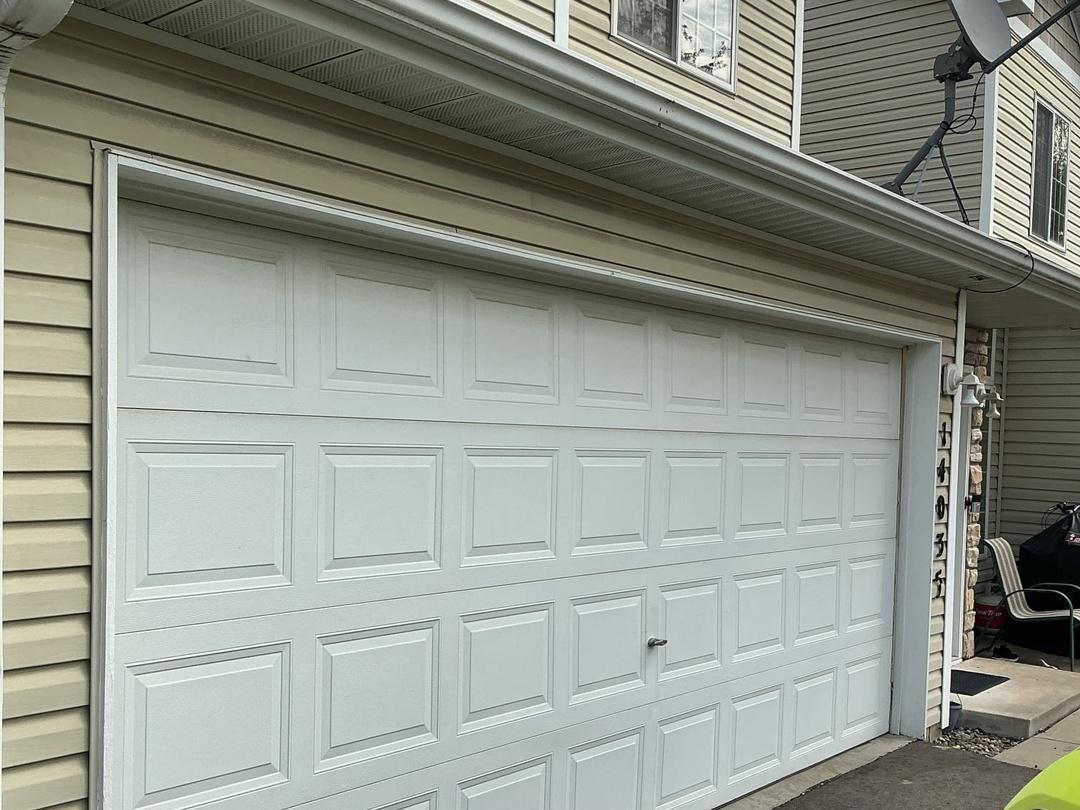 White garage door after track repair service in Savage Minnesota